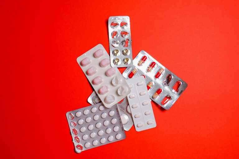 Medicines on a red table