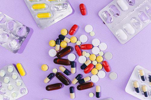 Colorful pills and capsules arranged in blister packs