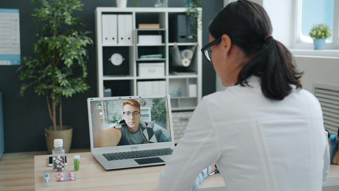 Doctor conducting a virtual consultation with a patient.